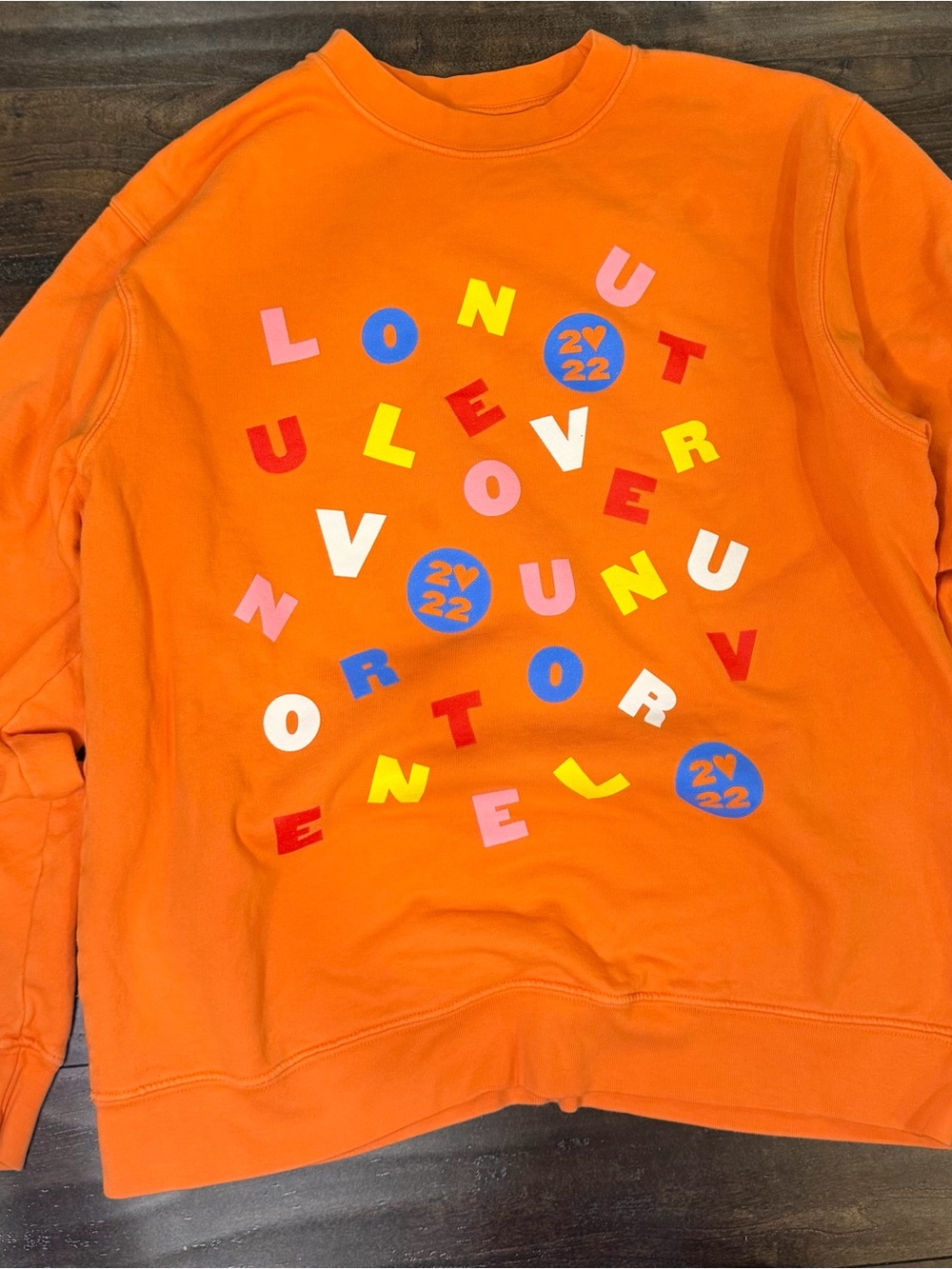 Bright Orange Graphic Sweatshirt with Multicolor Lettering